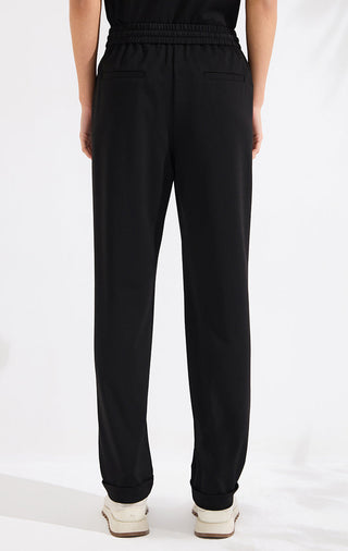 Black wide-leg pants with elastic waist, back patch pockets, tapered wide leg
