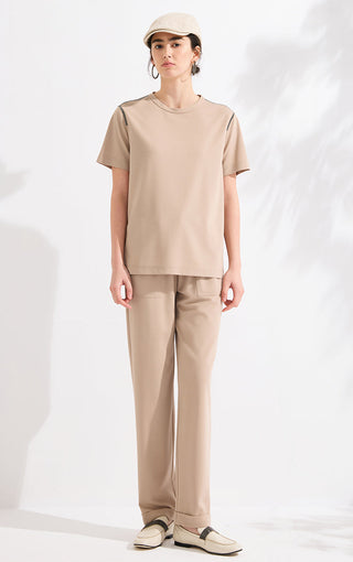 Beige-khaki wide-leg pants with elastic drawstring waist and relaxed straight legs