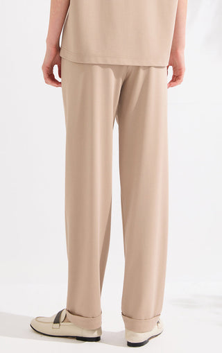 Khaki straight-to-wide leg pants with elastic waistband and clean side seams