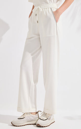 Ivory white wide-leg pants with drawstring ties and front patch pockets