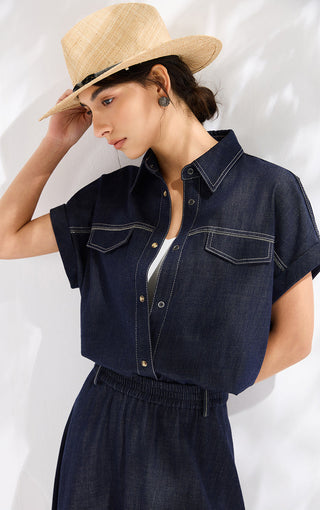 Ink blue denim cropped shirt with pointed collar, button placket, and chest pockets