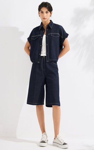 Ink blue cropped denim shirt with pointed collar, button placket, and chest pockets