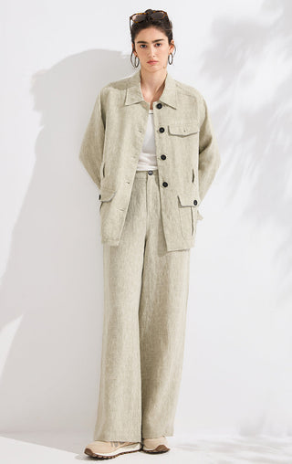 Light greige linen high-waist wide-leg trousers on model, full length with button front