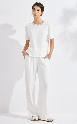 White wide-leg cotton pants with elastic waist and relaxed drape