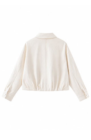 Beige cotton zip-up jacket with stand collar, shown from the back.