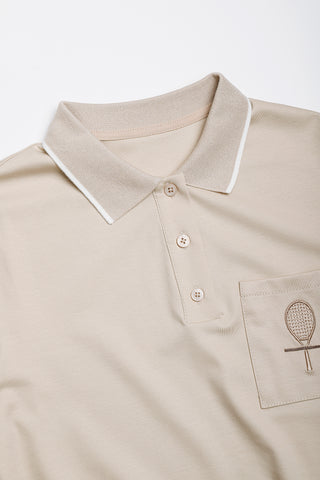 Camel polo dress collar with buttons and chest pocket; embroidered racket accent.
