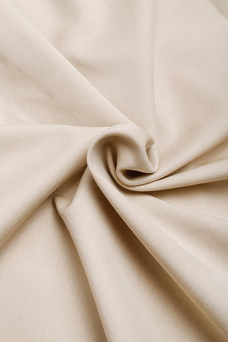Camel cotton polo pleated dress fabric drape close-up, soft cotton texture