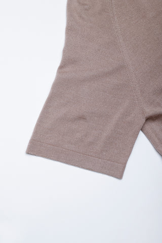 Hem detail of taupe short-sleeve knit dress, smooth ribbed finish