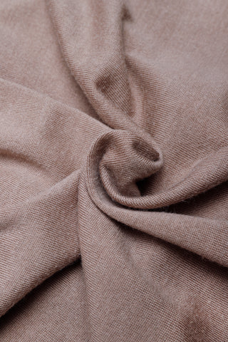 Taupe knit fabric close-up with soft texture and subtle weave