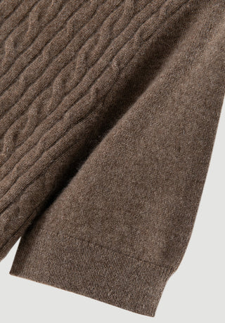 Brown cable-knit cashmere short-sleeve turtleneck sweater close-up of textured knit