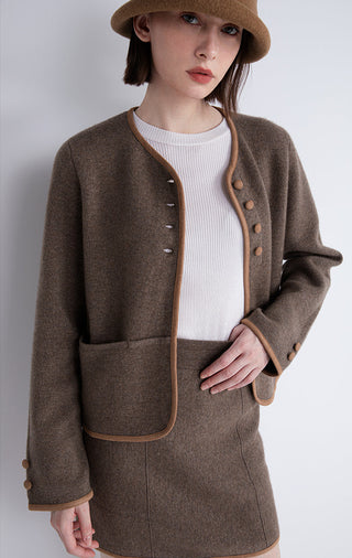 Dark brown contrast-trim jacket with gold buttons and patch pocket at the waist