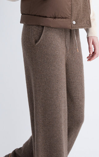 Dark camel knit lounge pants with side pockets and straight leg silhouette