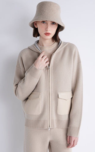 Beige hooded wool-cashmere jacket with zip front, two patch pockets, and ribbed waist