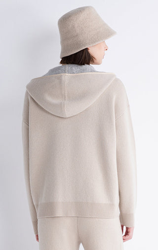 Back view of beige hooded zip jacket with ribbed hem and hood lining