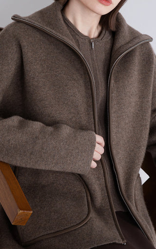 Dark brown wool-cashmere zip jacket close-up, sheepskin-trim zipper and patch pocket