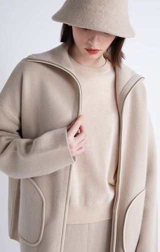 Camel zip jacket close-up, sheepskin-trim zipper edge and front patch pocket