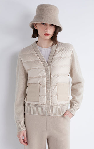 Beige cashmere-down knit coat front with quilted pockets and snap-button closure