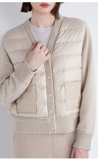 Beige down-knit coat close-up: quilted front panels and snap-button placket