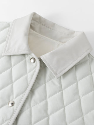 Light greige quilted down jacket close-up, snap buttons and turned collar