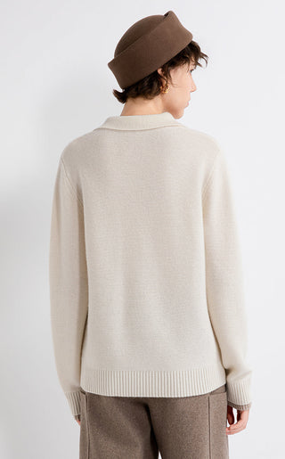 Light beige polo knit sweater shown from back with ribbed hem and cuffs