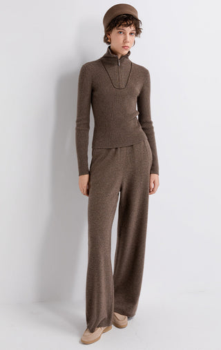 Brown wool-cashmere wide-leg knit pants on model, full length with ribbed hem