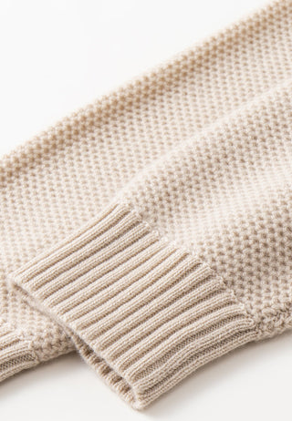 Camel knit sweater sleeve cuff with ribbed stripes and contrast trim