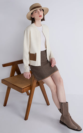 Beige wool-cashmere zip cardigan with sheepskin-trim pockets and rib-knit cuffs