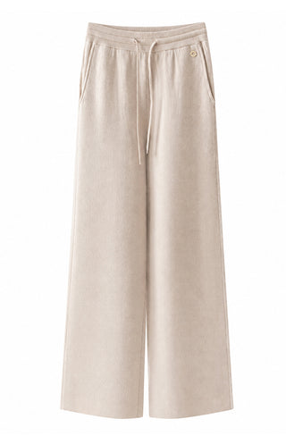 Light tan knit drawstring pants with elastic waist and wide legs