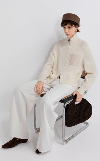 Ivory zip-up cardigan with front leather patch pocket and ribbed cuffs and hem