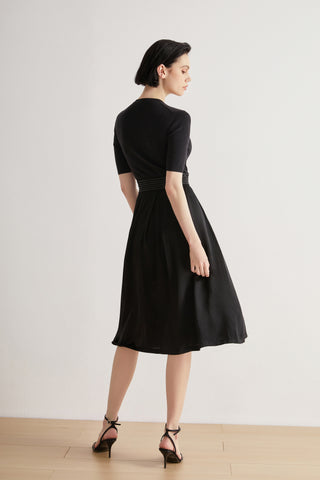 Black midi dress with short sleeves and beaded waist detail, side view