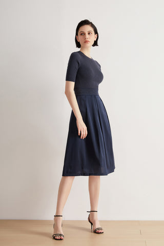 Deep blue short-sleeve midi dress with fitted ribbed bodice and beaded waist detail