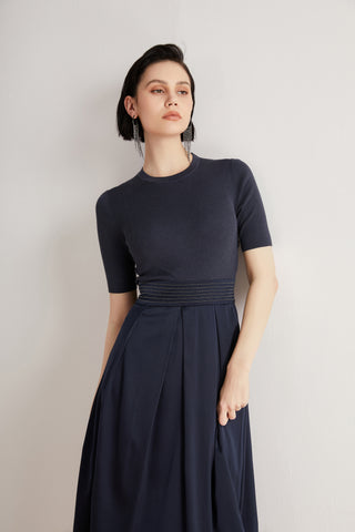 Deep blue wool-silk short-sleeve midi dress showing beaded waist detail and ribbed neckline