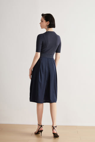 Deep blue midi dress in wool-silk with beaded waist detail, three-quarter flare from waist