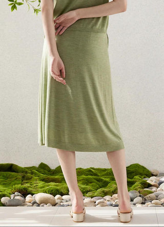 Green wool-silk midi skirt with gathered front seam and flowing A-line hem