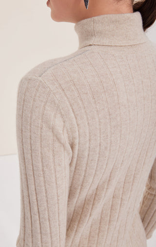 Camel ribbed cashmere turtleneck sweater close-up of shoulder and sleeve seam